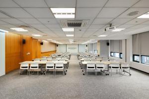 a large room with tables and chairs in it at Somerset Palace Seoul in Seoul +51 photos