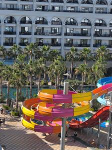 a water park with a colorful water slide at Crown Apartments in Golem