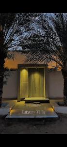 a building with a door in front of it at Le mirage in Tozeur