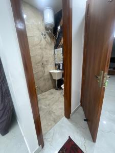 a bathroom with a toilet and a sink at Hotel 48 in Amritsar