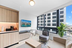 an apartment with a living room with a large window at Downtown Miami Condo w Pool & Great Location in Miami