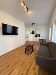 a living room with a couch and a table at MeerZeit in Kappeln