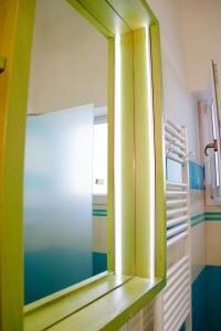 a mirror on a shelf in a room at Federico's Vila in Lecce +41 photos