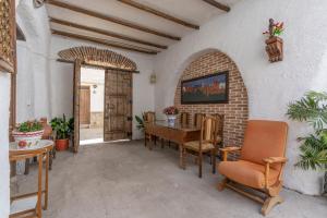 a dining room with a table and chairs at Posada De Santiago in Rubite