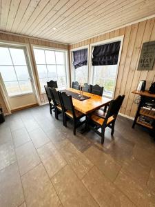 a dining room with a wooden table and chairs at Trysilbua 1173 in Trysil