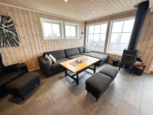 a living room with a couch and a table at Trysilbua 1173 in Trysil