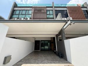 a building with a hallway leading to a door at Walnut Grove Premium Pool Villa in Batu Caves