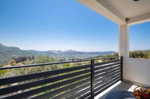a balcony with a view of the mountains at Apartmani Olga in Stari Bar