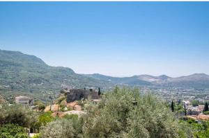 a view of a city with mountains in the background at Apartmani Olga in Stari Bar