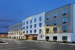an empty parking lot in front of a hotel at StudioRes by Marriott Jackson, TN in Jackson