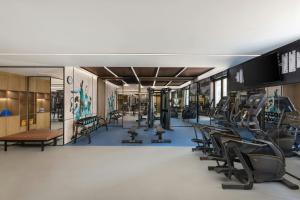 a gym with treadmills and elliptical machines at Four Points by Sheraton Jinan, High-Tech Zone in Jinan