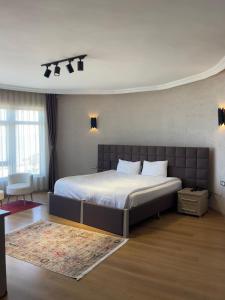 a bedroom with a large bed in a room at NEW HOTEL SAMSUN in Samsun +19 photos