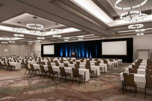 a large room with rows of chairs and screens at Sheraton Grand Sacramento in Sacramento +82 photos