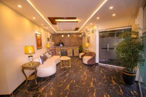 a living room with a couch and a table at Premier Inn Gulberg Lahore in Lahore