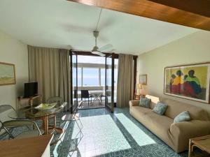 a living room with a couch and a table at Appartamento Zipser II in Grado