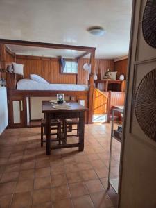 a room with a bed and a table in a room at Aurelia Verdon in Angles
