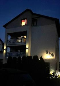 a house at night with a lit up at Pensjonat Semida in Władysławowo