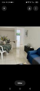 a picture of a living room with a table and a bed at Âncora Horto da barra in Barra dos Coqueiros