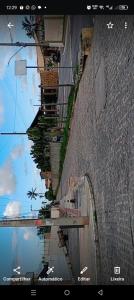 an image of a street with a reflection in the water at Âncora Horto da barra in Barra dos Coqueiros