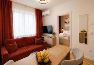 a living room with a couch and a table at Urban Getaway Sarajevo with Free Parking in Sarajevo