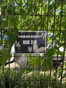 a sign that is on a fence at Hub 2A in Calcio