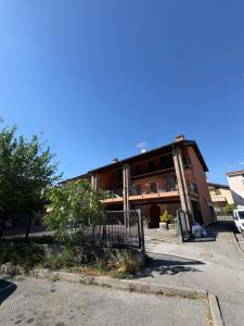 a building with a fence in front of it at Hub 2A in Calcio