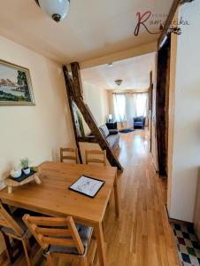 a dining room and living room with a table and chairs at Gästehaus Pension Romantika in Cochem