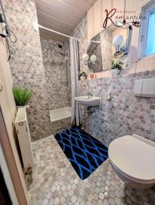 a bathroom with a toilet and a sink at Gästehaus Pension Romantika in Cochem +22 photos