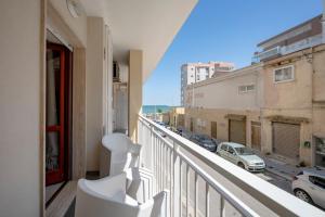 a balcony with a view of a street at Levante Eight Sea View Apartment in Bari