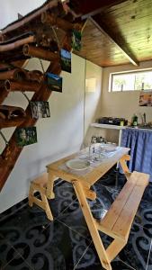a bathroom with a wooden table and a sink at Aguadulce Climbing House in Choachí