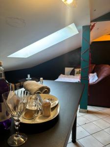 a table with a plate of food on top of it at Second&Home in Przeźmierowo
