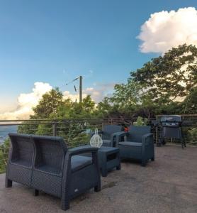 a group of chairs and tables on a patio at Cardedeu Domos in Álvarez