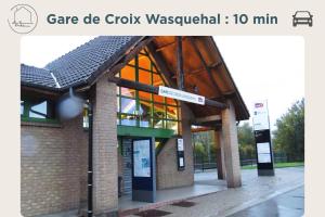 a gas station with a sign in front of it at Le Nid - Parking - 15 min centre de Lille in Wasquehal