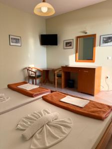 a room with a table with a mirror and a desk at Blue escape in Nafplio