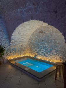 a pool of water in a room with a tunnel at Suite Diffuse - Widespread Suite Collection PCB LUXURY in Ostuni