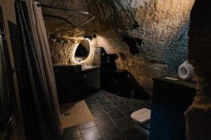 a bathroom with a sink and a mirror at La Voûte Etoilée in Doué-la-Fontaine +10 photos