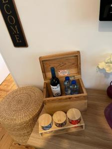 a wooden box with bottles of essential oils on a table at Camurichico in Figueira da Foz