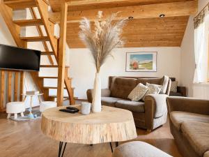 a living room with a couch and a table at Penzión Liezky in Mýto pod Ďumbierom