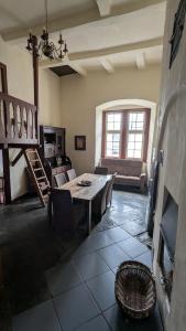 a living room with a table and a couch at Altstadthaus in Arnsberg