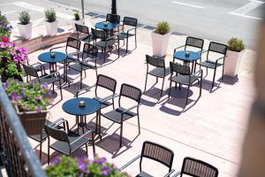 an overhead view of tables and chairs on a sidewalk at Castello Mare Residence in Herceg-Novi +30 photos