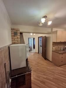 an empty kitchen and living room of a house at Apartmenti Ezerkrasti in Jaunpils +6 photos