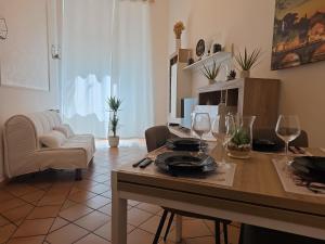 a living room with a table with wine glasses at Liberty House Ten in Rome