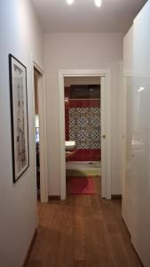 a hallway with a bathroom with a sink and a mirror at Casa Daniela in Velletri +45 photos