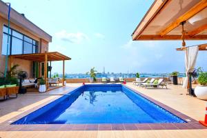 a swimming pool on the roof of a house at Vintano Hotel in Lagos