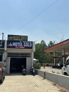 a hotel room with two motorcycles parked in a garage at Hotel Gold in Faridabad