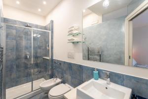 a bathroom with a sink and a toilet and a shower at My Suite Sorrento in Sorrento +24 photos