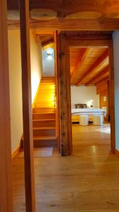 a room with stairs and a bed in the background at B&B Court1828 in Lillianes