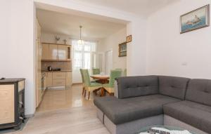 a living room with a couch and a table at Kuća za odmor Katini dvori in Novalja