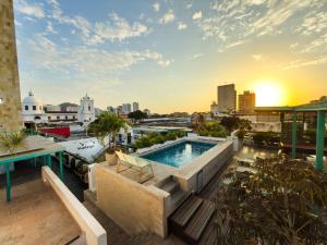 a view from the roof of a building with a swimming pool at Masaya Santa Marta in Santa Marta