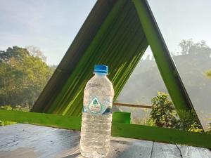 a bottle of water sitting on top of a table at Ella Cool Air Cabana in Ella